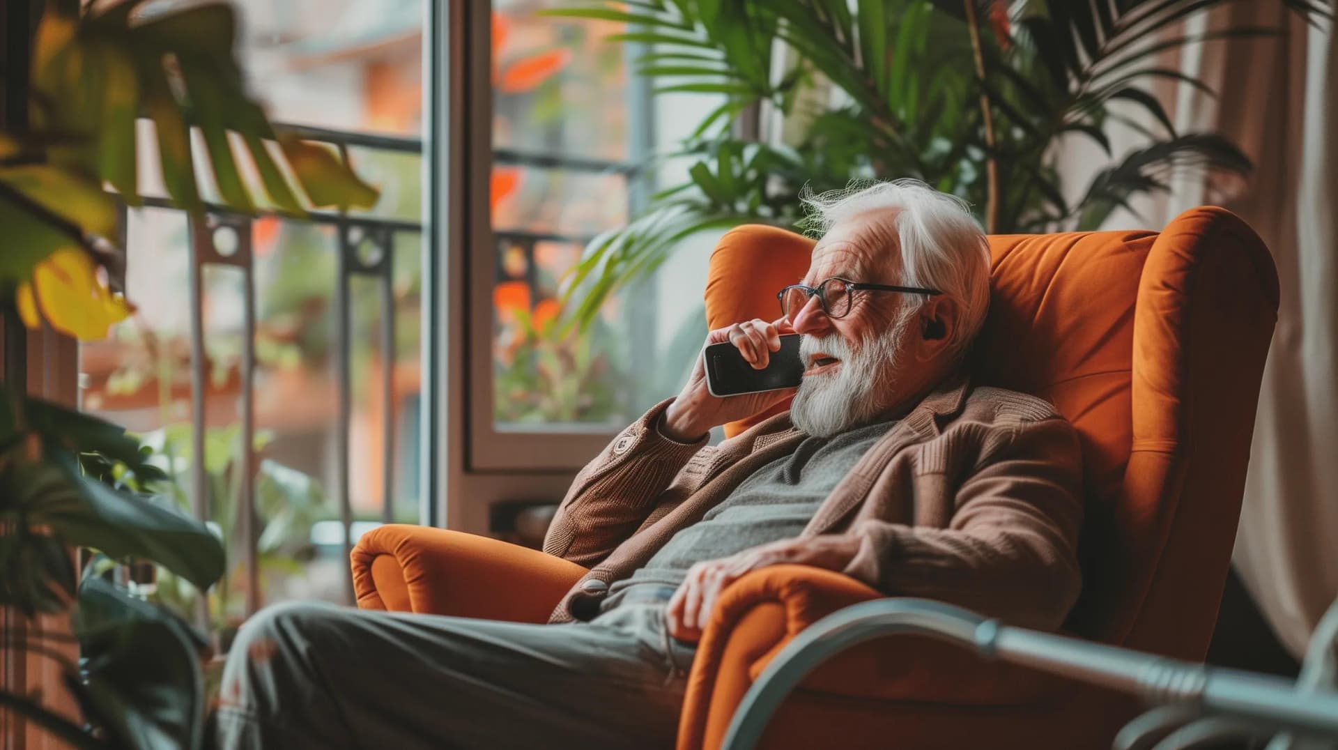 A senior sitting in the living room, talking to a healthcare professional over the phone