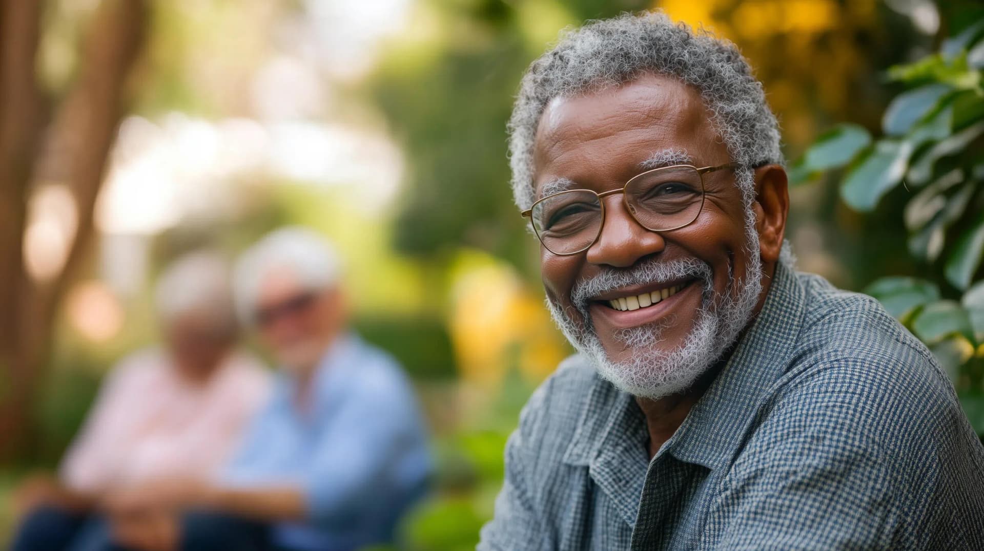A senior healthcare patient smiling at the camera indicating satisfaction to the care they received